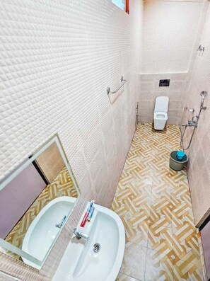 Shower, towels, soap, toilet paper