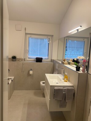 Hair dryer, towels, soap, toilet paper