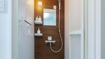 Shower, hair dryer, towels, shampoo