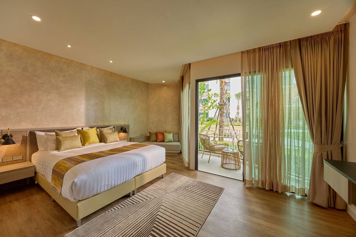 Habitación Deluxe, vistas al jardín | Minibar, caja fuerte, cunas gratuitas y camas supletorias