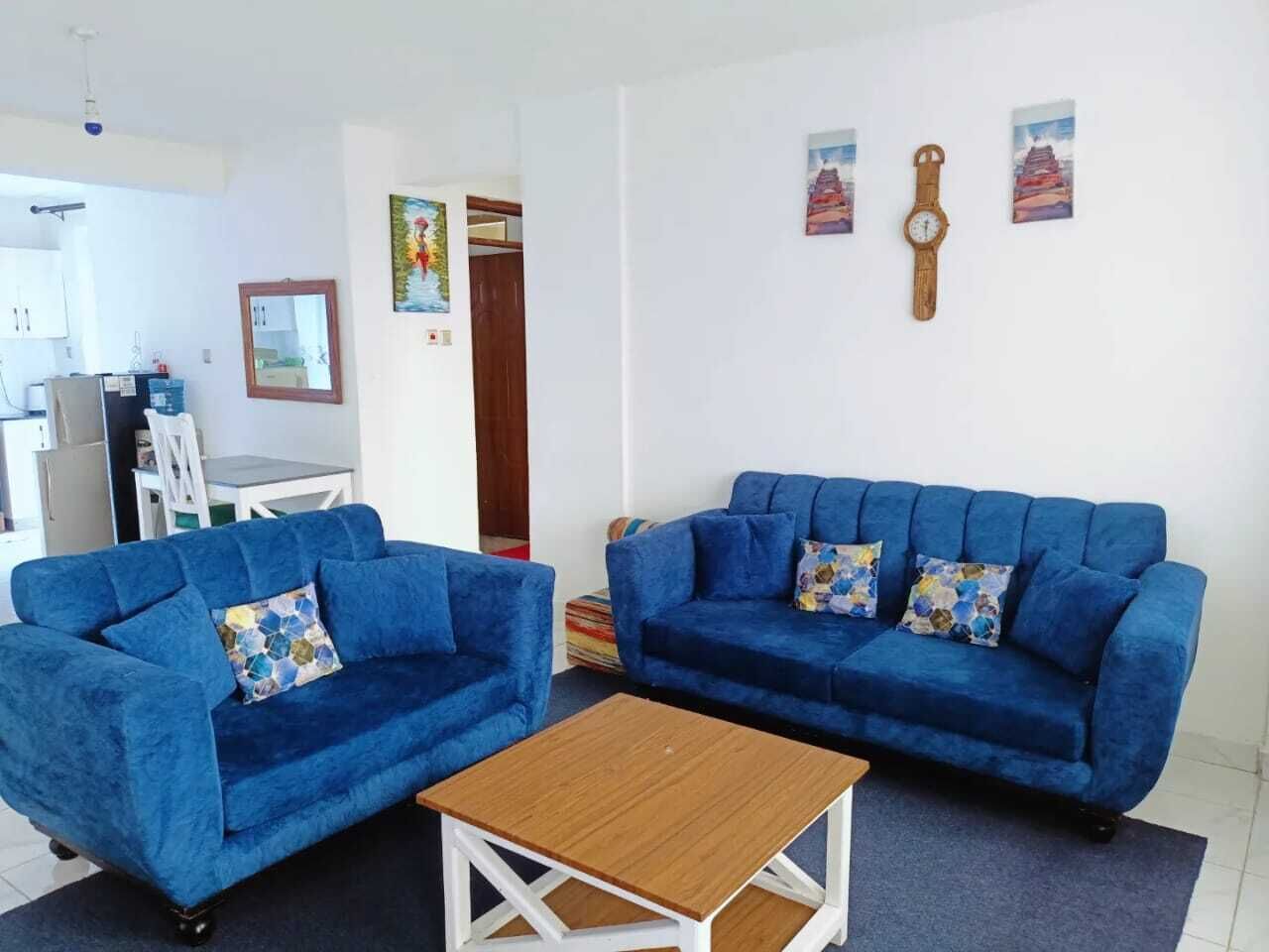 Family Apartment, Balcony, City View | Living area | 24-inch Smart TV with digital channels