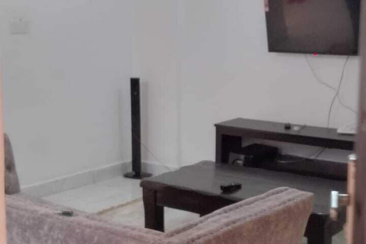 Elite Apartment, Balcony, City View | Living area | 24-inch Smart TV with digital channels