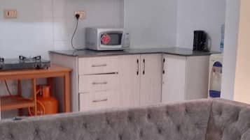 Elite Apartment, Balcony, City View | Living area | 24-inch Smart TV with digital channels