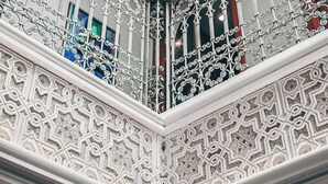 An ornate architectural detail with intricate patterns and designs. - Riad Tislite & Spa (Marrakech)