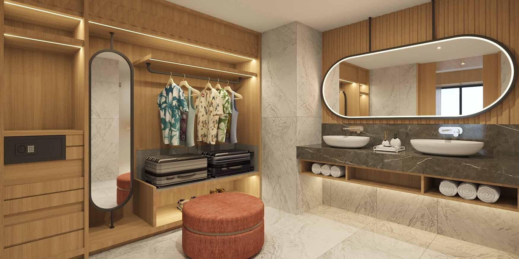 Een moderne badkamer met houten kastjes, een grote spiegel, een wastafelmeubel met een waskom en een kledingrek met kleding.