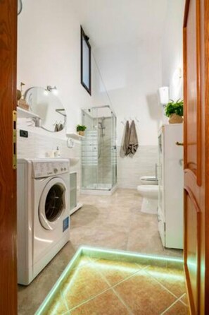 Apartment, Sea View | Bathroom | Bathrobes
