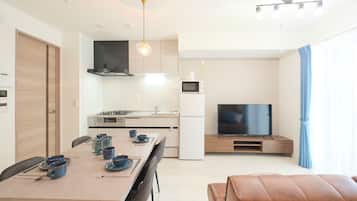 A, 4-person Accomodation, Non Smoking | Living area | Flat-screen TV