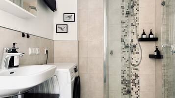 Shower, hair dryer, towels, soap