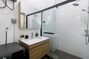 Shower, towels, soap, toilet paper