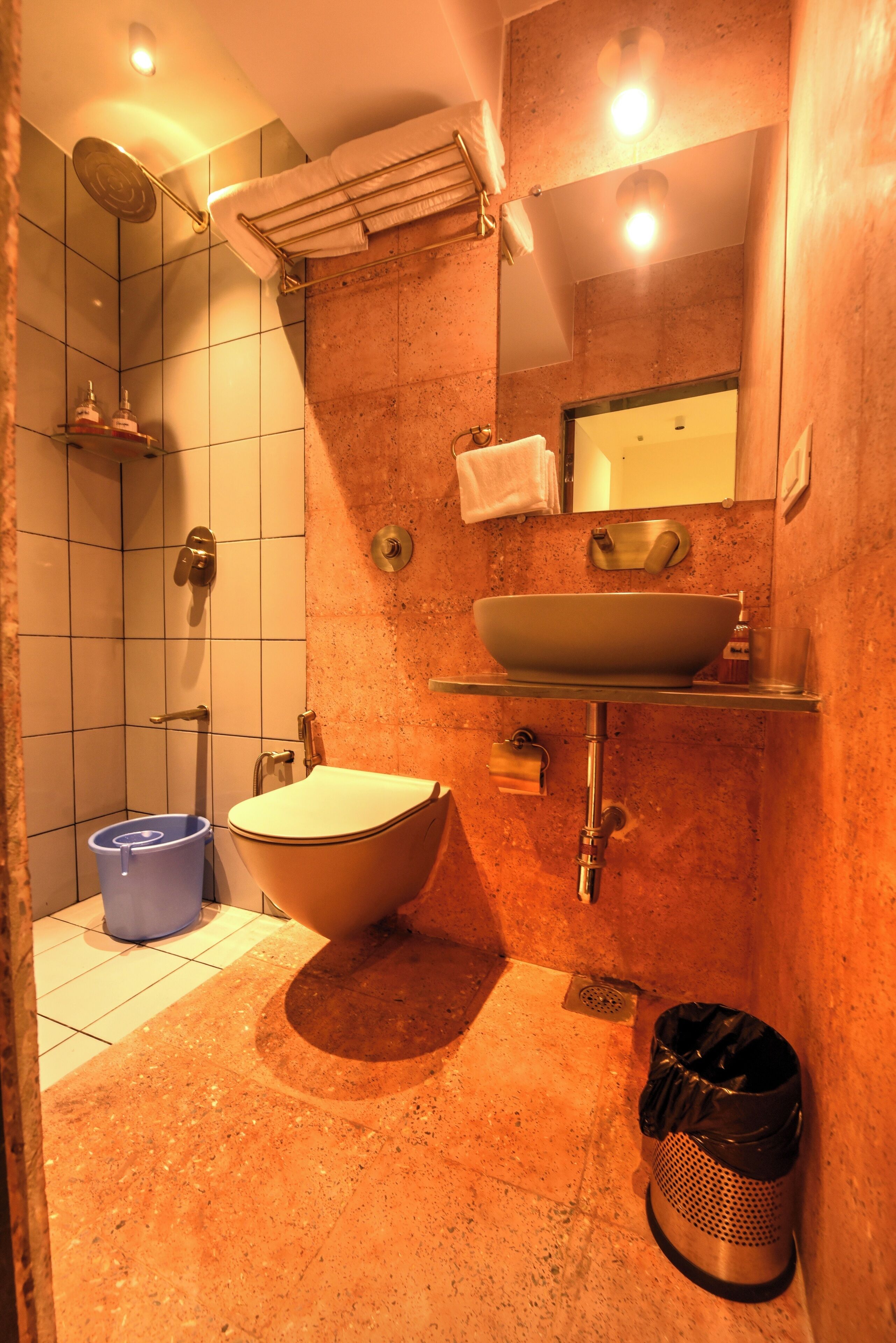 A bathroom with a freestanding bathtub, a sink with a mirror above it, and a shower area.