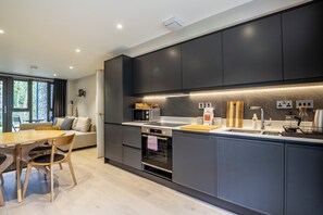 Apartment, 1 Bedroom | Private kitchen | Fridge, microwave, cookware/dishes/utensils