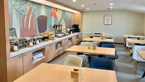 A cafeteria with wooden tables, chairs, and a buffet counter. - Hanting Hotel (Zhengzhou)