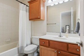 Shower, hair dryer, towels, toilet paper