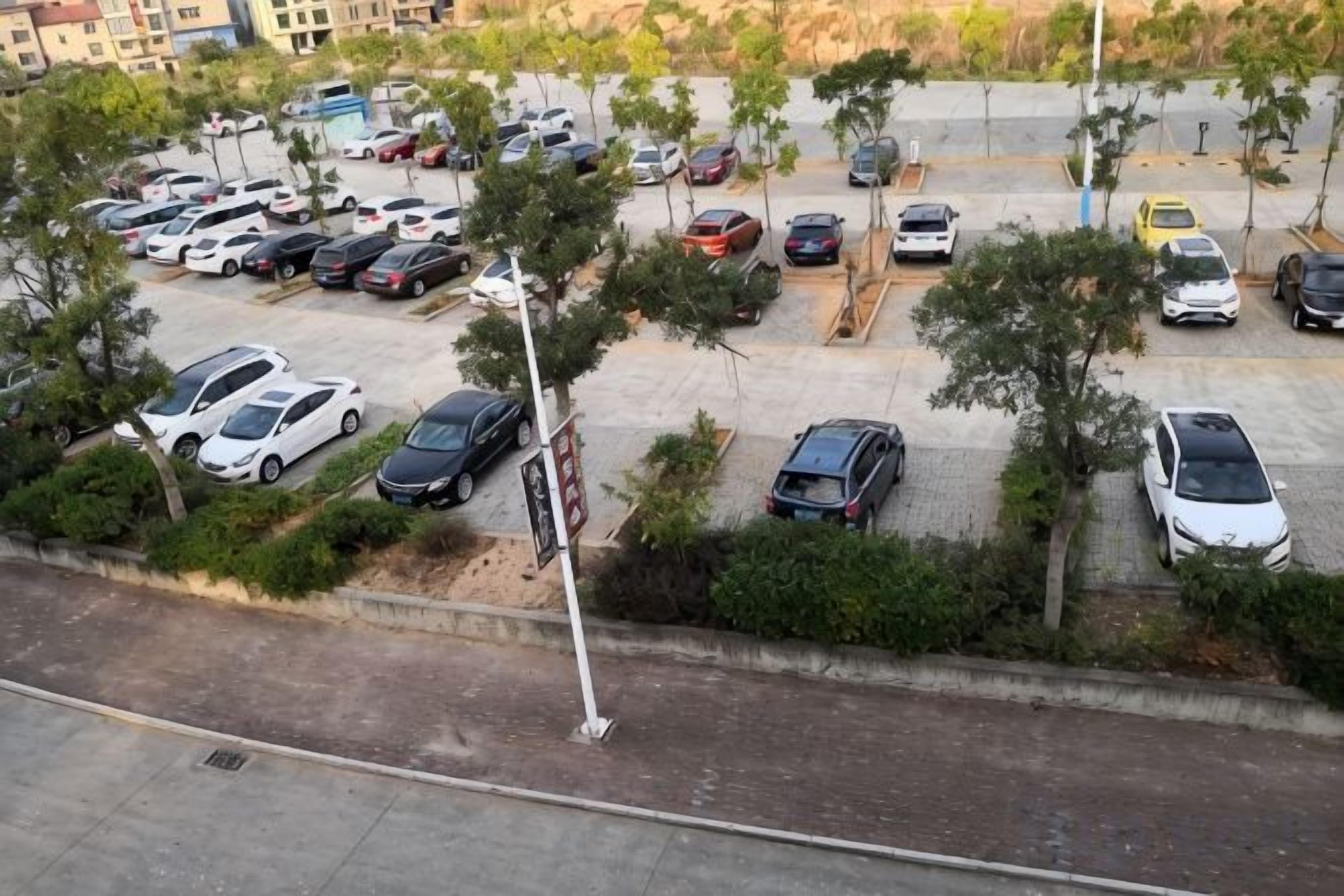A multi-level parking structure with several cars parked.