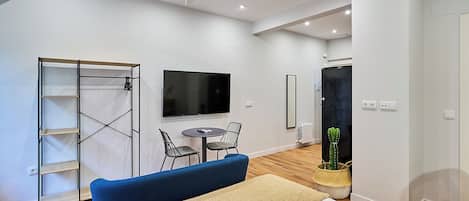 Comfort Studio, City View | Living area | TV