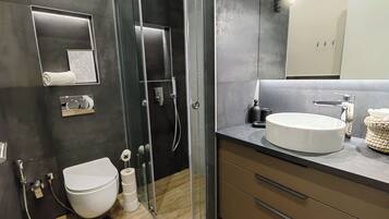 Shower, hair dryer, towels, soap