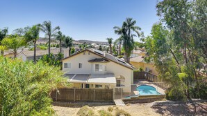 A residential house with a swimming pool, surrounded by palm trees and a hilly landscape. - Poway Retreat w/ Stunning Sunset & Mountain Views! (Poway)
