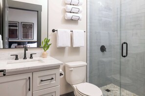 Shower, hair dryer, towels, shampoo