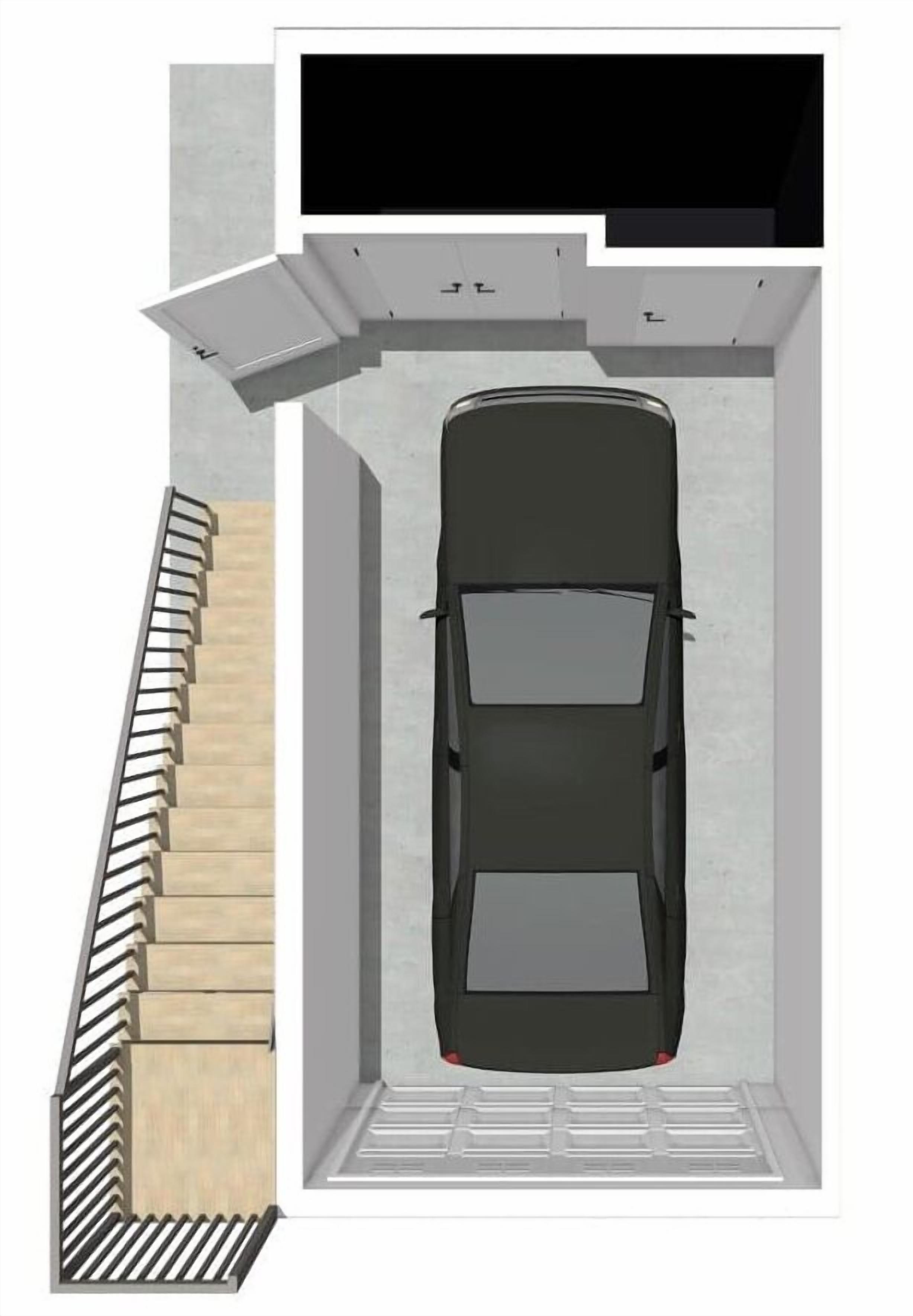 A car parked inside a garage with a staircase leading up to the entrance.
