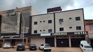 A hotel named 'Londres' with a modern facade, multiple parking spaces, and a visible 'Hotel' sign. - Hotel londres (Gama)