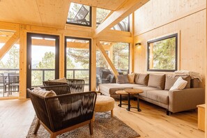 Superior Chalet # 18 mit Sauna & Hot Tub | Living area | Flat-screen TV - Naturchalets Turracher Höhe by ALPS RESORTS (Stadl-Predlitz)