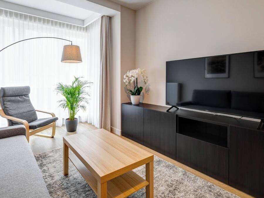 Suite, Balcony | Living area | 55-inch flat-screen TV with cable channels