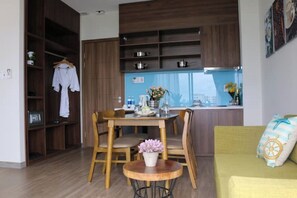 Cozy living space with a kitchenette, dining area, and comfortable seating.