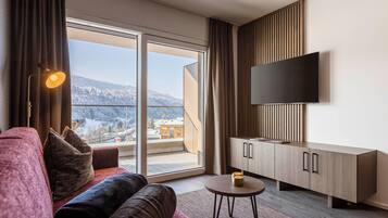 Ferienwohnung mit 1 Schlafzimmer | Living area | 50-inch flat-screen TV with satellite channels