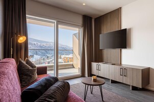 Ferienwohnung mit 1 Schlafzimmer | Zona de estar | Televisión de pantalla plana de 50 pulgadas con canales por satélite