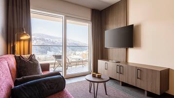 Ferienwohnung mit 1 Schlafzimmer | Living area | 50-inch flat-screen TV with satellite channels