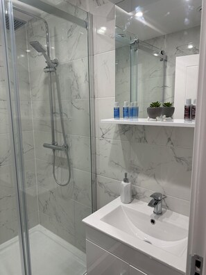 Shower, hair dryer, towels, soap