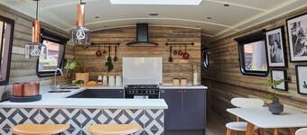 Boutique boat hotel moored on the Floating Pocket Park in West London. 