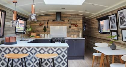 Boutique boat hotel moored on the Floating Pocket Park in West London.