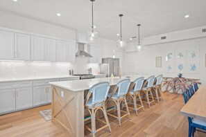 Enjoy cooking in this well-equipped kitchen with a central island and appliances.