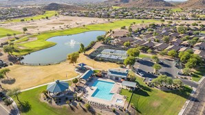 An aerial view of a residential area with a swimming pool, tennis courts, and a golf course. - BEAUTIFULLY Updated San Tan House of Serenity✨- Free WiFi, Game Room, Sleeps 10  (San Tan Valley)