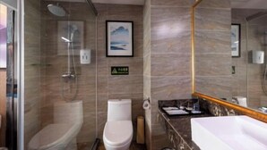 A bathroom with a shower, toilet, sink, and a large mirror. - Yoyo Hotel (Zhongshan Bus Terminal) (Zhongshan)