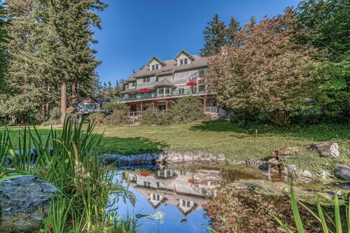 Family friendly water view escape with deck, games and garden views