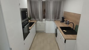 Coffee/tea maker, fridge, microwave, oven