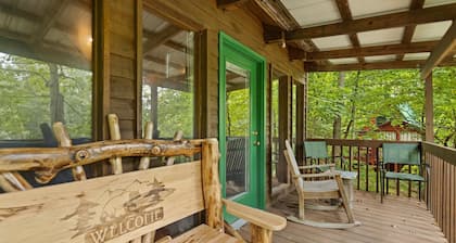 Quaint, heavily forested cabin, mountain valley view.