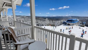 A balcony with a view of a ski slope and a ski lift. - AS 436: Front-Row Ballhooter Retreat in the Heart of the Village (Snowshoe)
