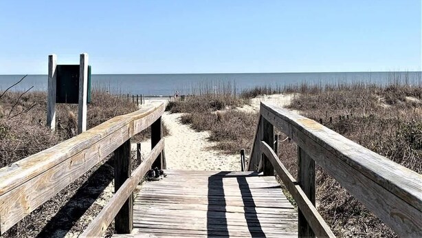 A wooden boardwalk leading to a beach with a clear sky. - Tennis Villa F20 - Close to Beach (Hilton Head Island)