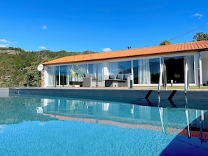 Seasonal outdoor pool, pool umbrellas, pool loungers