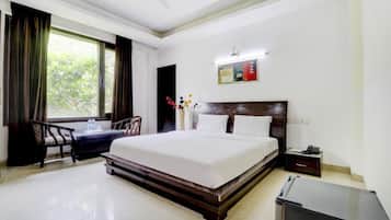 Habitación ejecutiva | Escritorio y espacio para trabajar con un portátil