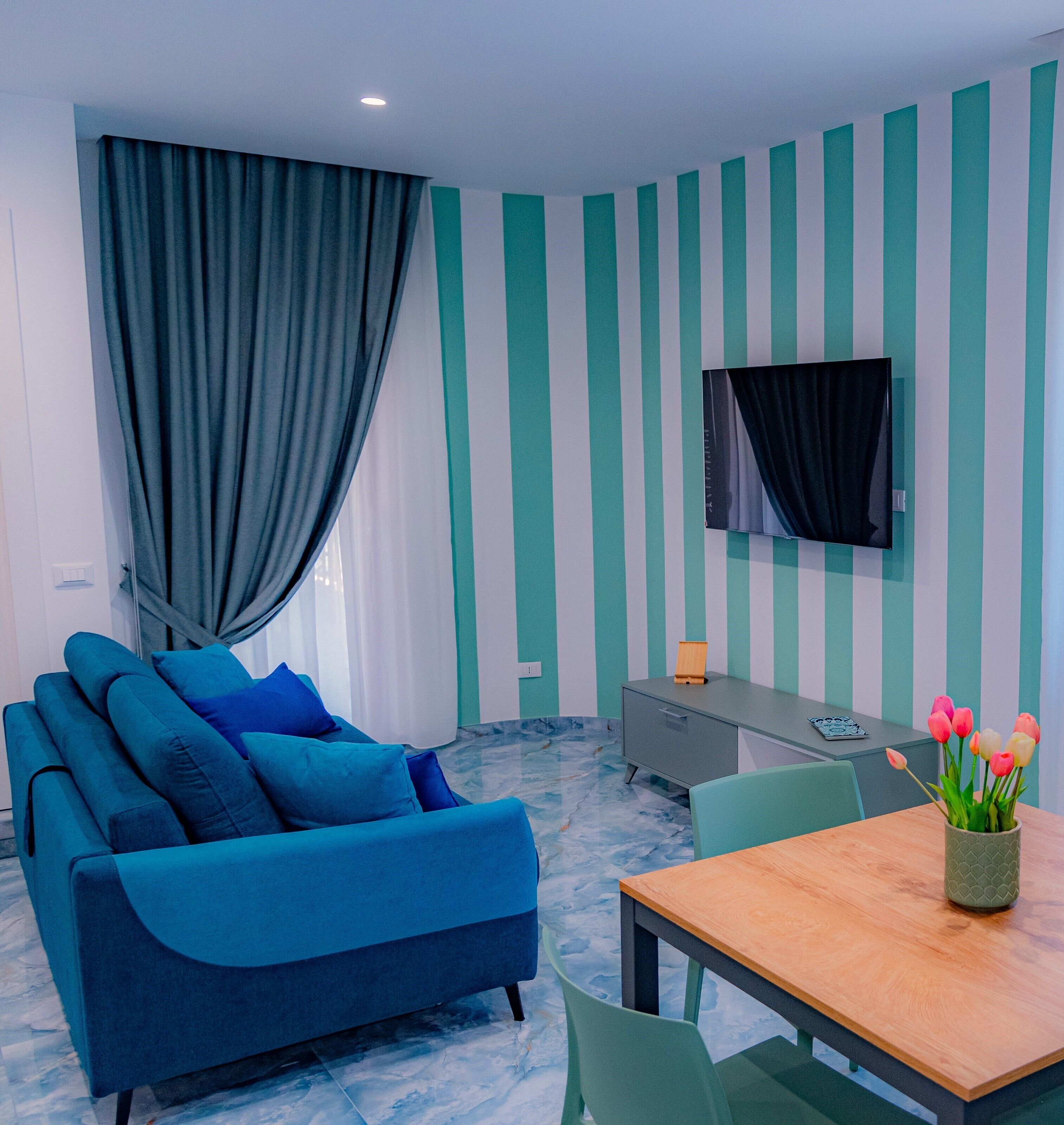 Deluxe Studio, Balcony, City View | Living area | TV