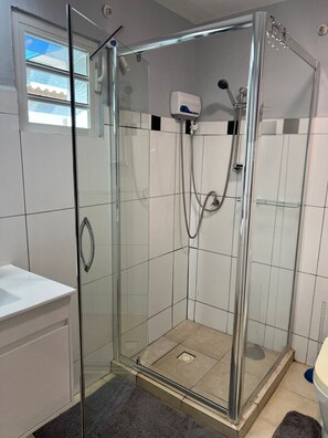 Shower, towels, soap, toilet paper