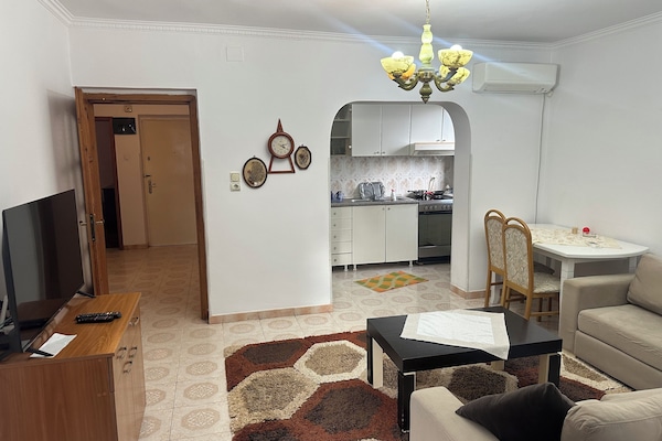 Family Apartment, 3 Bedrooms, City View | Living area | Flat-screen TV