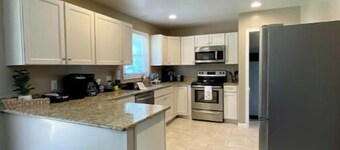 Hidden Gem spacious 4 bedroom cozy home fenced in yard