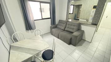 Apartment | Living area | 32-inch flat-screen TV with satellite channels, TV, streaming services