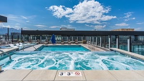 A rooftop pool with a clear view of the mountains in the background. - Premium SLC Luxury- Penthouse VIEWS+ Top Amenities (Salt Lake City)