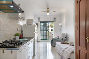 Fridge, microwave, stovetop, coffee/tea maker